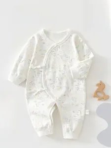 Detailed view of long-sleeve cotton baby romper with soft floral patterns and snap buttons