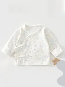 Detail of newborn baby kimono top with soft floral print and side string ties