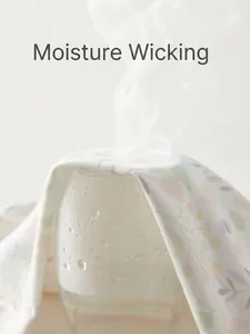 Breathable floral cotton baby romper fabric demonstrating steam permeability and soft texture