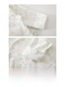 Detail of soft 100% cotton newborn sleeve with delicate floral print and durable double stitching