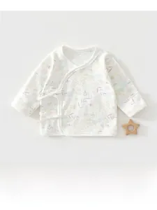 Flat lay of newborn cotton kimono top with delicate all-over floral print and tie closure