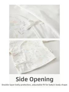Detail of newborn cotton kimono top showing the wrap-around tie closure and floral pattern