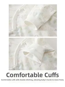 Detailed macro view of double-stitched cuffs on floral print cotton baby romper