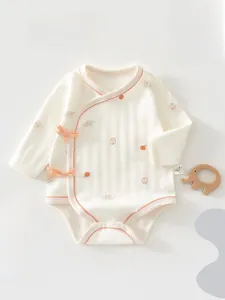 Detail of soft cotton baby bodysuit with long sleeves and snap button closures