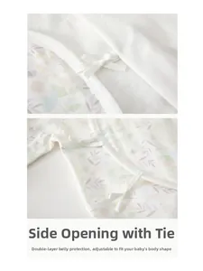 Detail of baby cotton onesie featuring side-tie closure and floral pattern for belly protection