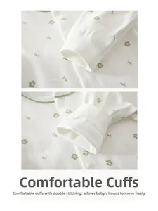 Detail of floral baby romper featuring ribbed cuffs and durable double stitching