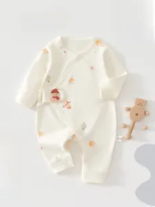 Detail of newborn cotton bodysuit with red snowman patch and cute house prints