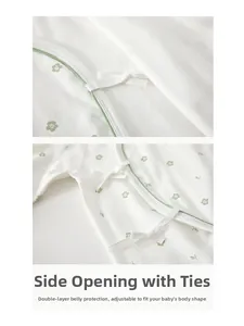 Detail of newborn cotton kimono bodysuit featuring side tie closure and floral print
