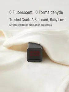 Baby organic cotton romper undergoing safety test for zero formaldehyde and fluorescent