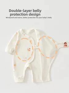 Detail view of double-layer belly protection design on a cotton baby romper