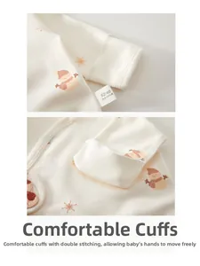 Détail des poignets à double couture sur un body bébé en pur coton avec imprimé bonhomme