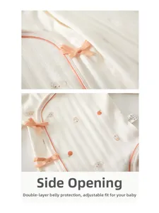 Detail of baby cotton bodysuit with side-tie design and soft double-layer belly protection