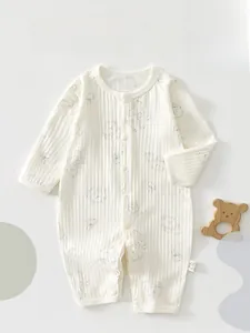 Detail of baby waffle cotton romper with honey bear prints and front button closure