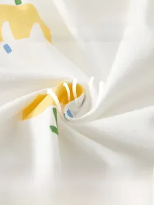 Detail of soft breathable cotton fabric for baby rompers showing moisture-wicking texture