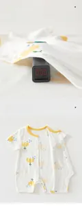 Close-up of floral baby romper showing non-fluorescent material testing at zero level
