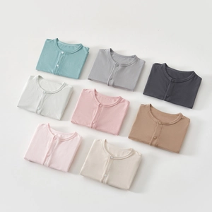 Close-up of 8 Morandi colors baby rompers in soft, breathable cotton fabric