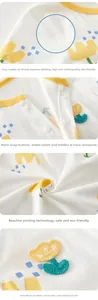 Detail view of baby romper featuring soft cotton fabric, resin snaps, and 3D embroidery