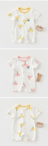 Detail of baby cotton short sleeve romper with flower print and snap button closure