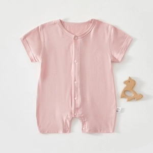 Detailed view of pink infant short sleeve bodysuit with snaps and size label 59/44