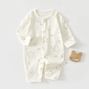 Detail of newborn cotton romper featuring ribbed texture and cute rabbit pattern