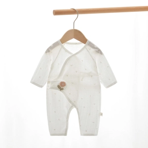 Detailed close-up of newborn floral romper featuring side-opening and ribbed fabric texture