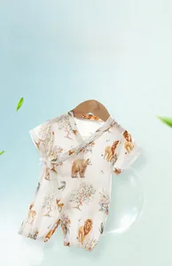 Detail of baby bamboo cotton short sleeve romper featuring cute animal print patterns