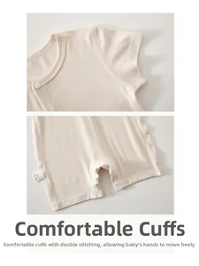 Detail view of double-stitched seams and smooth cuffs on infant modal short sleeve romper