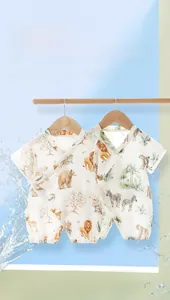 Detail of baby summer romper featuring breathable bamboo cotton and tropical animal print