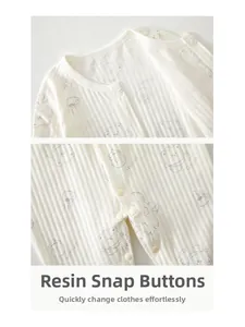 Detail of the resin snap buttons and breathable ribbed cotton fabric on the baby jumpsuit