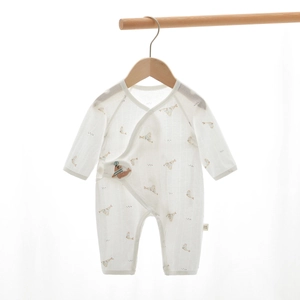 Detail of newborn baby cotton romper with kimono ties and cute animal prints
