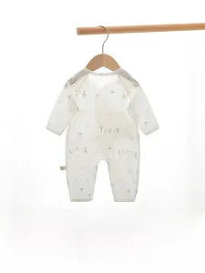 Detail of soft cotton baby romper with cute rabbit prints and breathable vertical texture