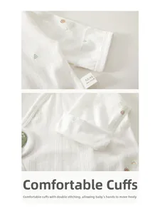 Close-up of double-stitched cuffs on 100% cotton newborn long sleeve baby shirt