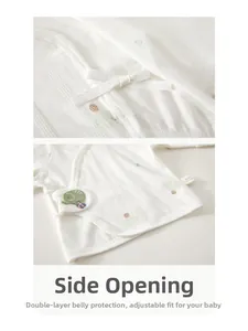 Detail of newborn baby kimono top with soft cotton side-ties and elephant embroidery