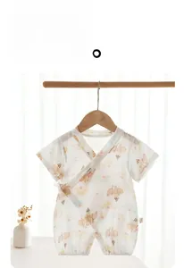 Detail of short sleeve bamboo cotton baby romper with ice cream and floral pattern