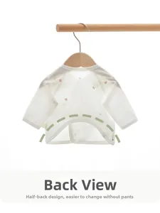 Detail view of white cotton newborn baby half-back shirt showing the open back design