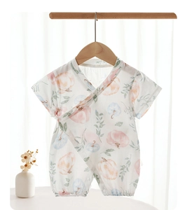 Detailed view of bamboo cotton baby romper with breathable gauze and pumpkin prints