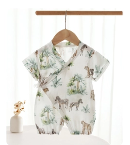 Detailed view of bamboo cotton romper with jungle animal print and kimono ties