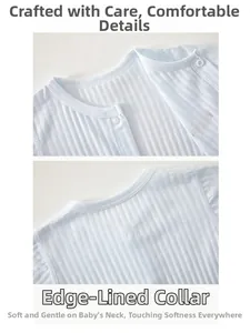 Detail of baby cotton rib romper featuring snap buttons and reinforced binding neckline