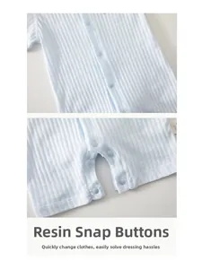Detail of blue newborn romper with breathable ribbed fabric and resin snap buttons