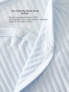 Detailed view of eco-friendly POM resin snap buttons on light blue ribbed baby bodysuit