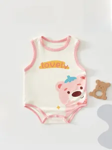 Detailed view of white cotton baby bodysuit featuring pink trim and a cartoon bear print