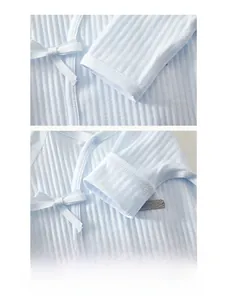 Detail of baby romper with ribbed cotton fabric, bow tie, and durable sleeve stitching