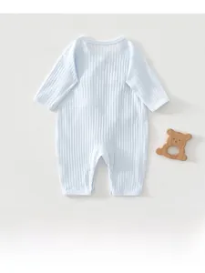 Detail of light blue newborn romper in soft ribbed knit fabric for infant comfort