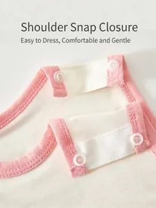 Infant cotton bodysuit featuring pink piping trim and shoulder snap button closure
