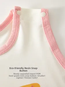 Detail of baby romper neckline with safe POM food-grade resin snap buttons and soft cotton