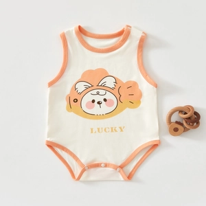 Detail of baby cotton bodysuit with lucky print, orange trim and bottom snap buttons
