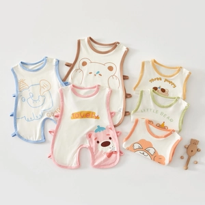 Close-up of baby sleeveless rompers with various cartoon patterns in soft cotton fabric