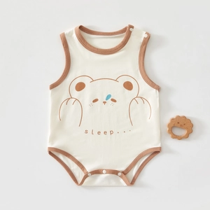 Detail of baby sleeveless bodysuit featuring bear print and snaps on a soft cotton fabric