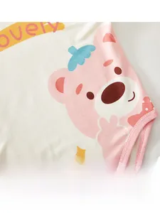 Close-up of soft cotton baby bodysuit featuring cute pink bear print and lovely lettering
