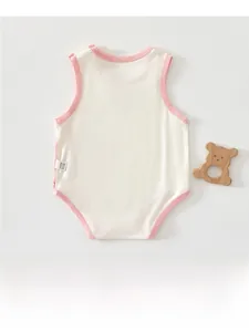 Close-up of pure cotton sleeveless baby bodysuit with soft pink and beige fabric